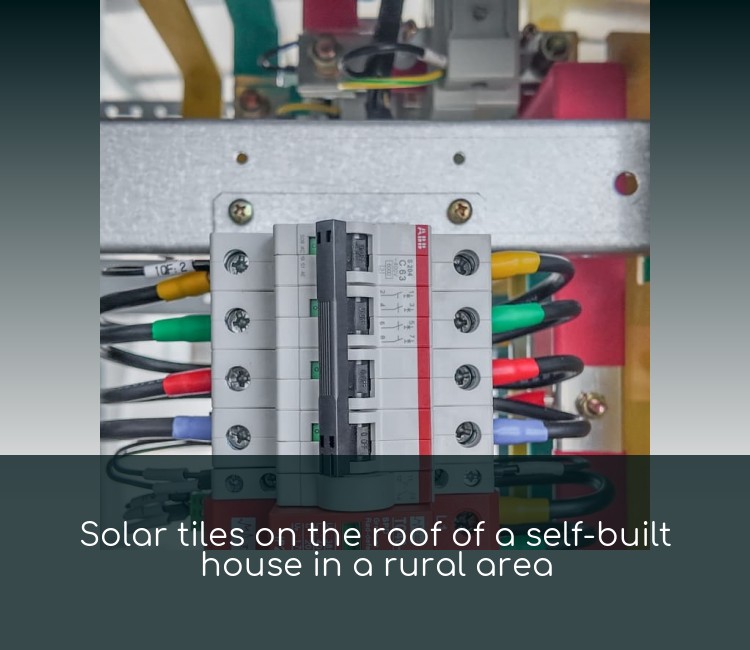 Solar tiles on the roof of a self-built house in a rural area